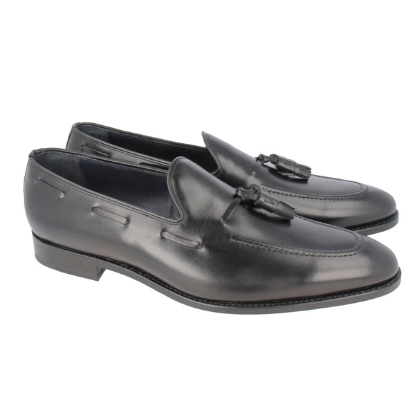 Black leather tassel loafers with sleek stitching and Goodyear welt, handcrafted in Portugal for refined style and all-day comfort.
