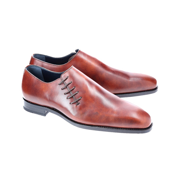 Bracklen brown wholecut Oxford shoes in Museum Calf leather, side-laced and Goodyear welted with a sleek soft chisel toe design.