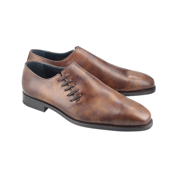 Chelmer brown wholecut Oxford shoes in Museum Calf full-grain leather, side-laced and Goodyear welted with a soft chisel toe design.