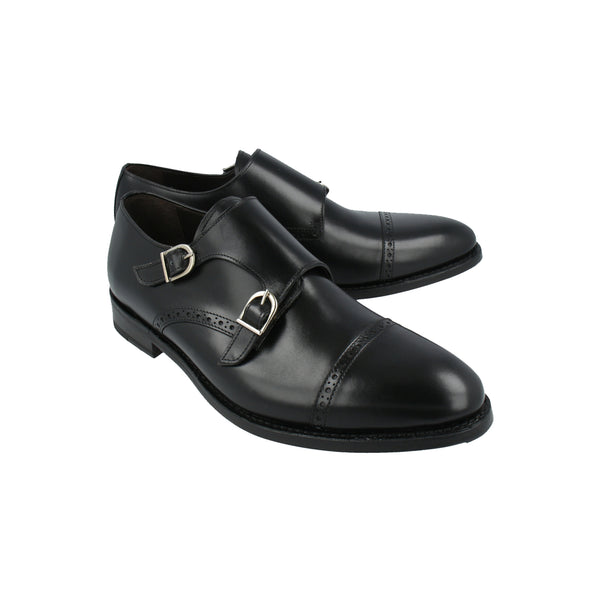Black leather monk strap shoes with silver buckles and Goodyear welted sole, crafted in Portugal for timeless elegance and comfort.