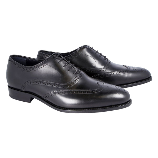 Black leather wingtip Oxford shoes with brogue detailing and Goodyear welt, handcrafted in Portugal for timeless elegance and comfort.