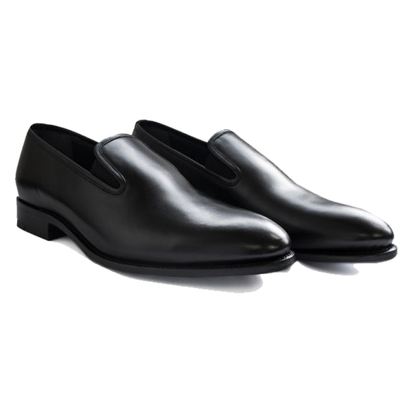 Black slip-on loafers in full-grain leather with sleek minimalist design, Goodyear welted and handcrafted in Portugal for all-day comfort