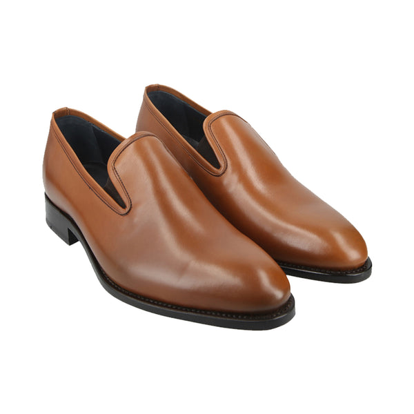 Tan slip-on loafers in full-grain leather with sleek stitching, Goodyear welted and handcrafted in Portugal for comfort, style, and durability.