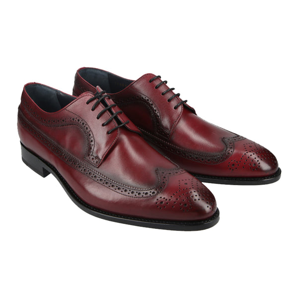 Antique wine derby shoes with brogue wingtip design in full-grain leather, Goodyear welted and handcrafted in Portugal for bold, classic style