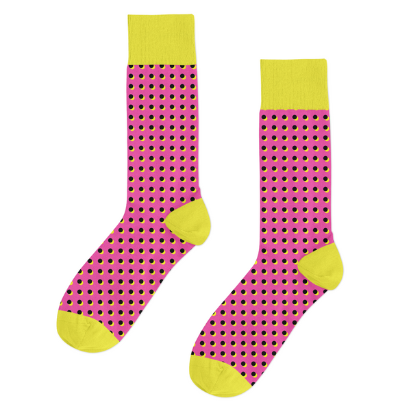 Yellow and pink polka dot socks in 100% combed cotton, designed for comfort and bold style. Fits EU sizes 39–46.