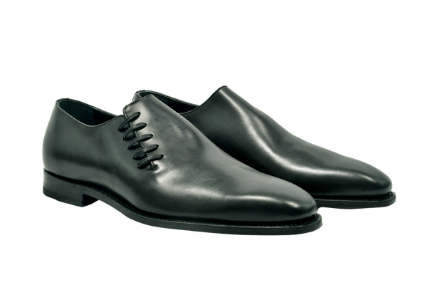 Black wholecut Oxford shoes in premium French leather with unique side lacing, Goodyear welted and handmade in Portugal for refined style