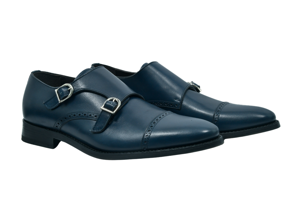 Navy blue full-grain Italian leather monk strap shoes with silver buckles and Goodyear welt, handcrafted in Portugal for refined comfort.