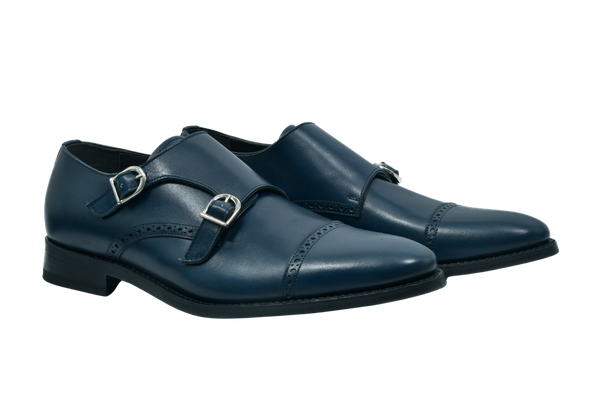 Navy blue full-grain Italian leather monk strap shoes with silver buckles and Goodyear welt, handcrafted in Portugal for refined comfort.