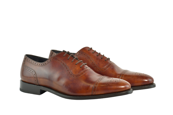 Museum Calf Bracklen Oxford shoes in rich brown leather with brogue detailing and Goodyear welt, handcrafted in Portugal for classic style. 
