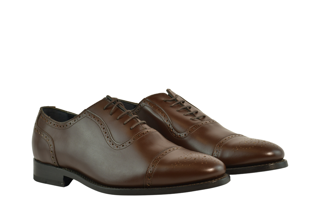 Chocolate brown Oxford shoes with brogue cap-toe design in full-grain leather, Goodyear welted and handcrafted in Portugal for classic elegance.