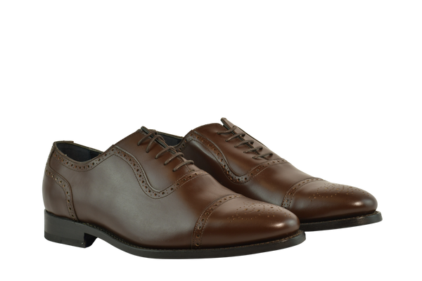 Chocolate brown Oxford shoes with brogue cap-toe design in full-grain leather, Goodyear welted and handcrafted in Portugal for classic elegance.