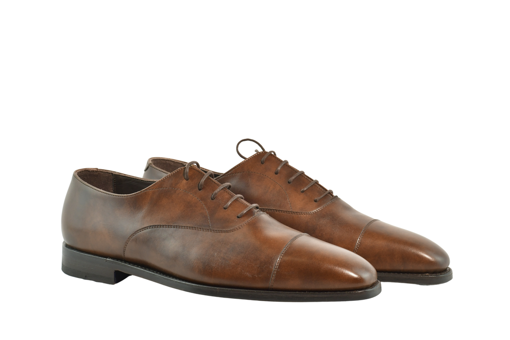 Museum Calf Chelmer cap-toe Oxford shoes in rich brown leather with Goodyear welt, handcrafted in Portugal for timeless style and comfort.